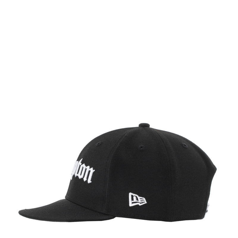 Black baseball cap with white embroidery and New Era flag patch at the front