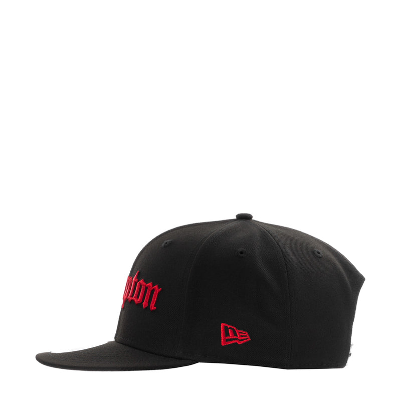 Black baseball cap with red side logo and New Era flag