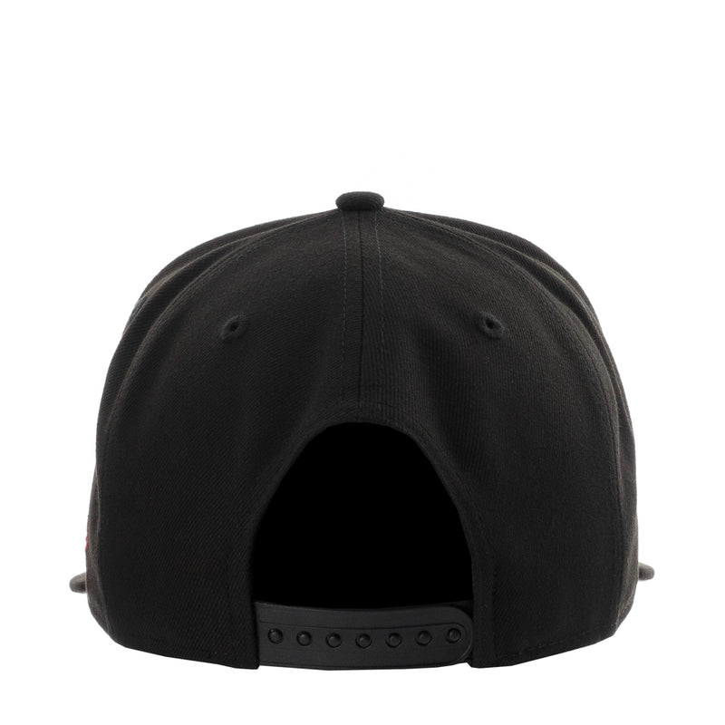 Black baseball cap back view with adjustable strap and ventilation holes