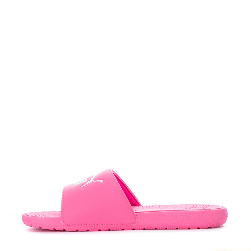 Kids hot pink slide sandals, angled view, white footbed and textured outsole
