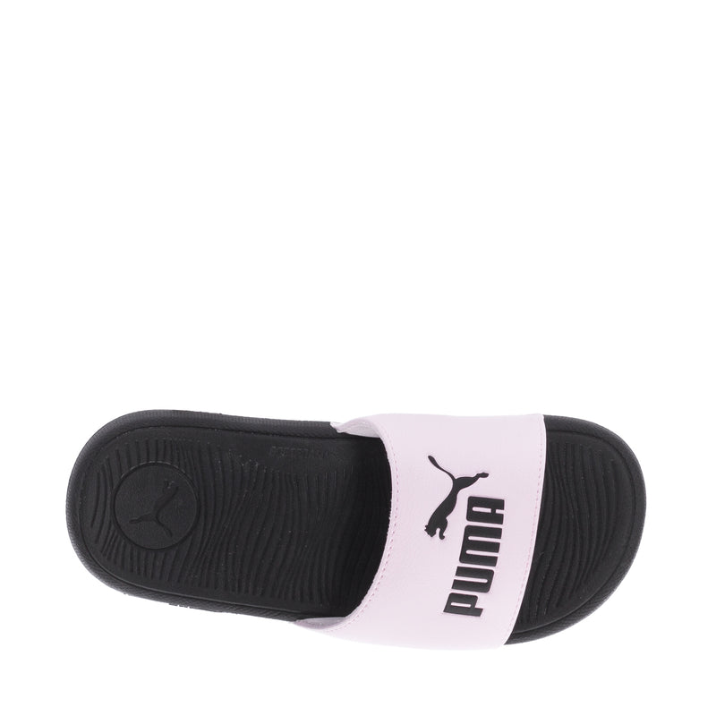Youth pink slide sandals with PUMA logo on strap and textured black sole.