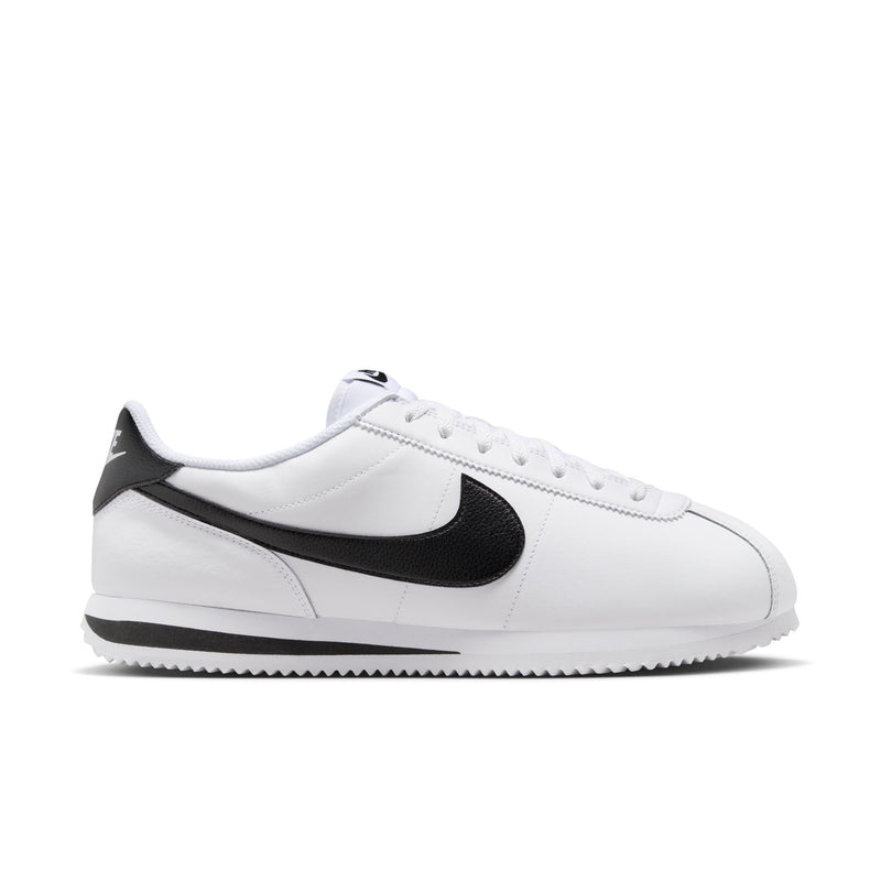 White and black men's low-top sneakers, side profile with Nike swoosh and laces