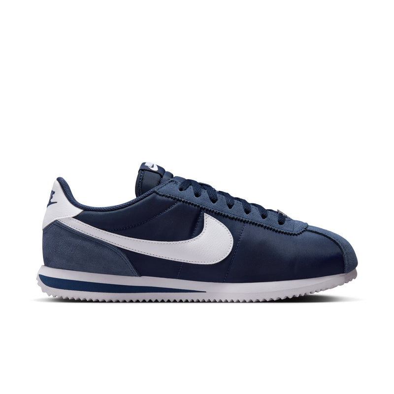 Men's Cortez low-top sneakers in navy and white; lace-up front and swoosh
