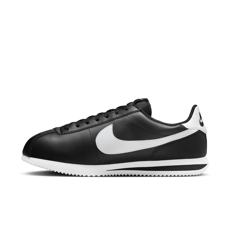 Men's black Nike Cortez sneakers with large white swoosh and lace-up upper