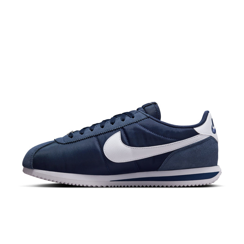 Men's Cortez low-top sneakers, side profile; white swoosh and navy upper
