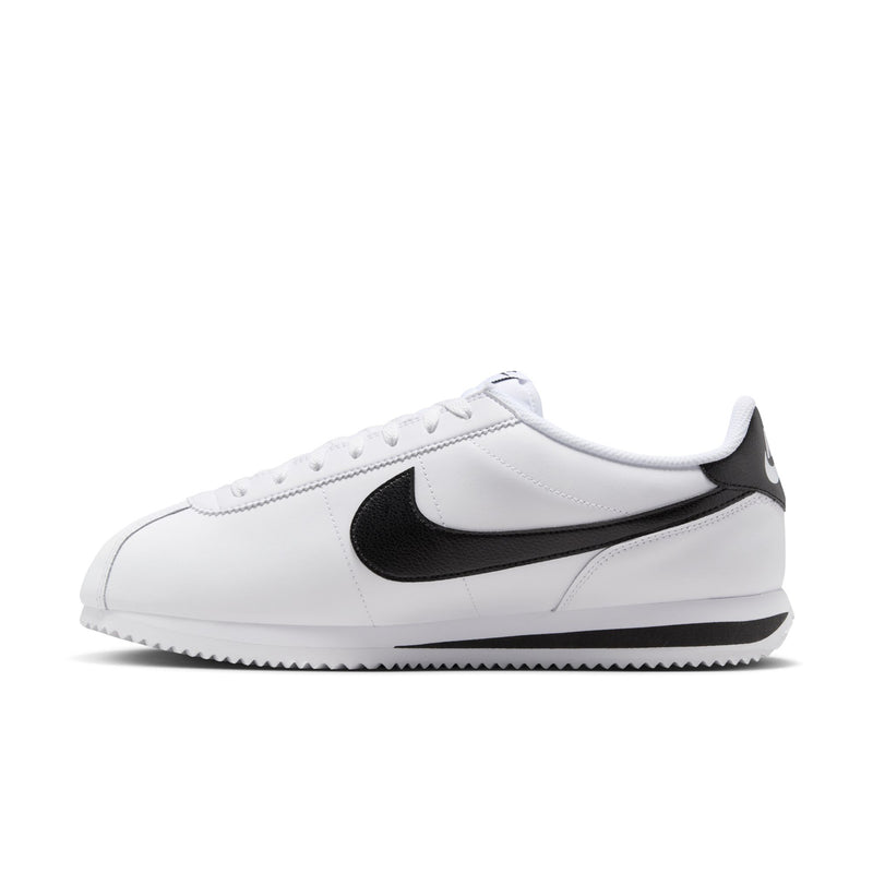 White men's low-top sneakers with black Nike swoosh, side profile and lace-up