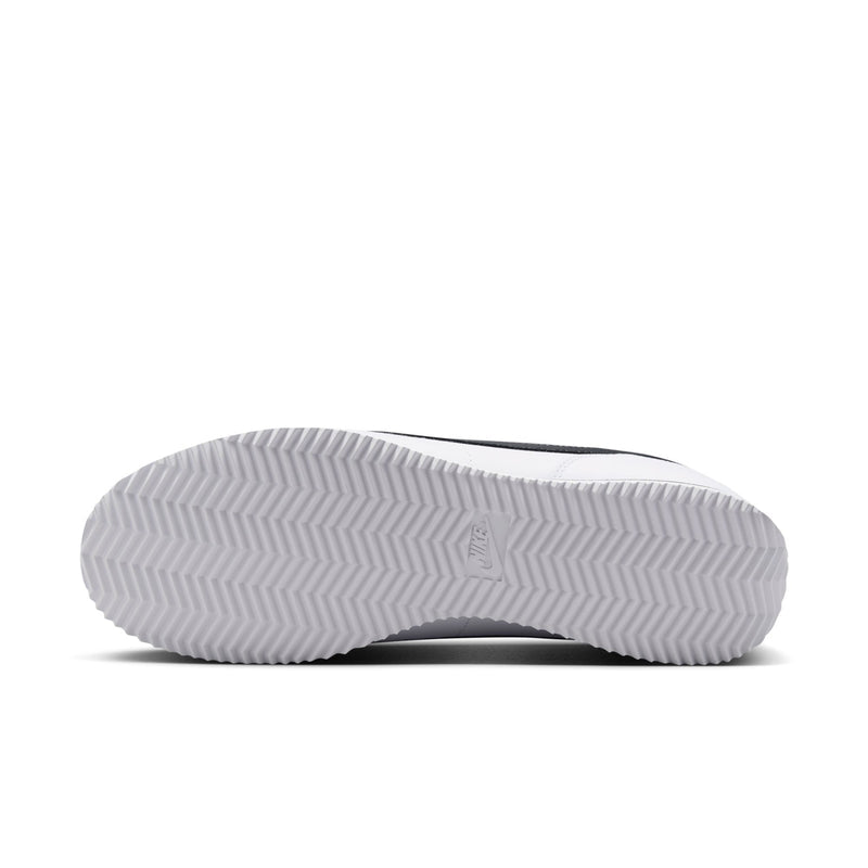 White men's low-top sneaker outsole view with herringbone tread pattern