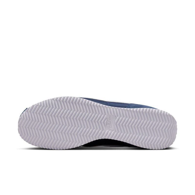 Men's Cortez sneaker outsole view with textured tread; white rubber sole