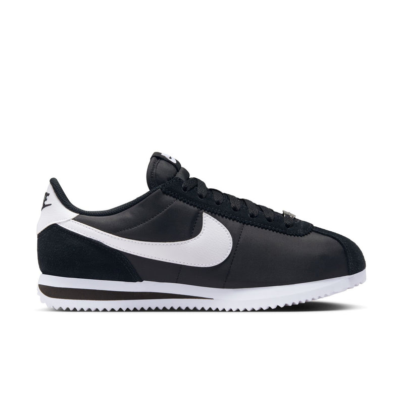 Women's Cortez low-top sneakers in black with white Swoosh and lace-up design