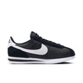 Women's Cortez low-top sneakers in black with white Swoosh and lace-up design