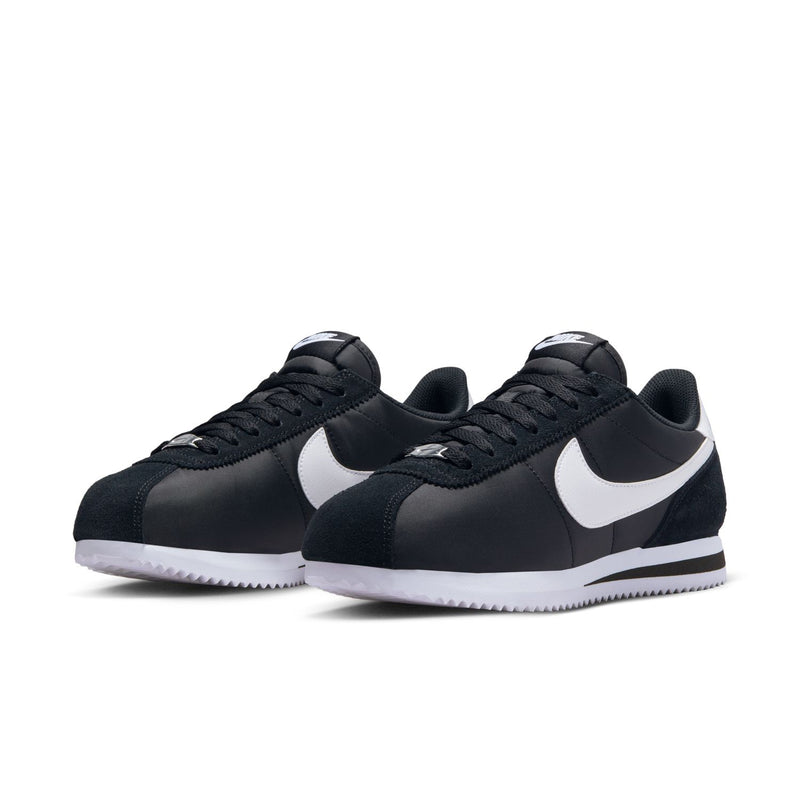 Women's Cortez sneakers, black uppers with white Swoosh, lace-up pair view