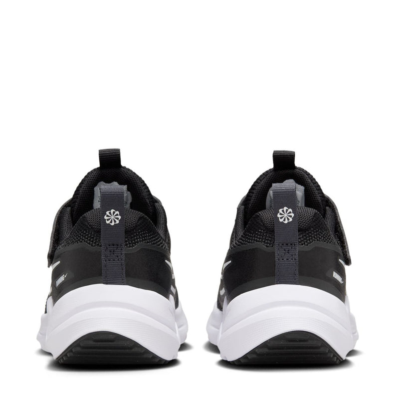 Kids black running shoes from heel view with white outsole and pull tabs