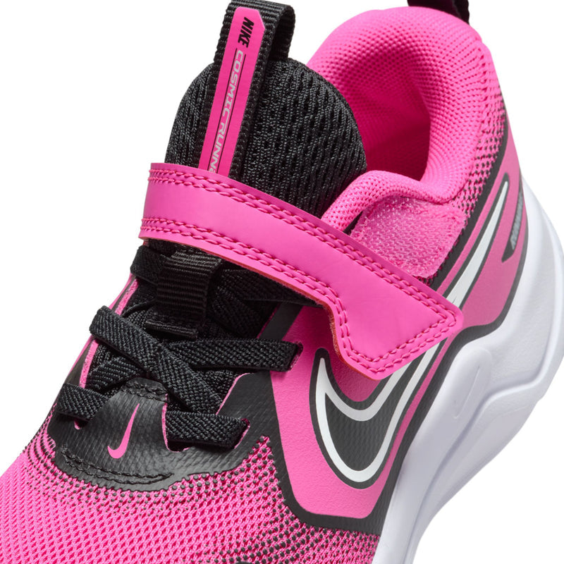 Close-up of pink kids' running sneaker upper with hook-and-loop strap and swoosh