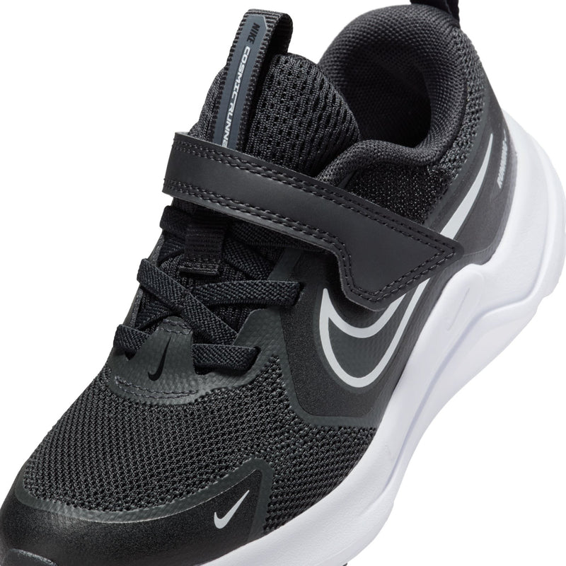 Kids black sneaker close-up with layered straps, lace-up top, and swoosh logo
