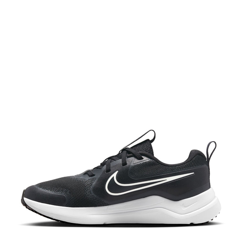 Youth black athletic sneakers with white swoosh, lace-up front, and cushioned midsole