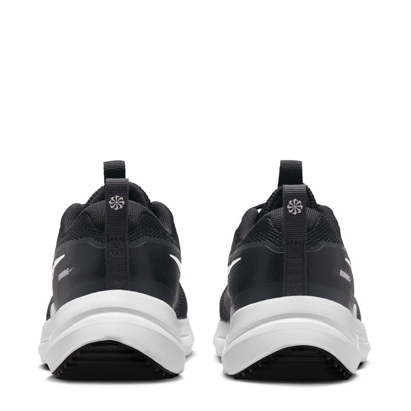 Youth black sneakers heel view with white midsole and pull tabs