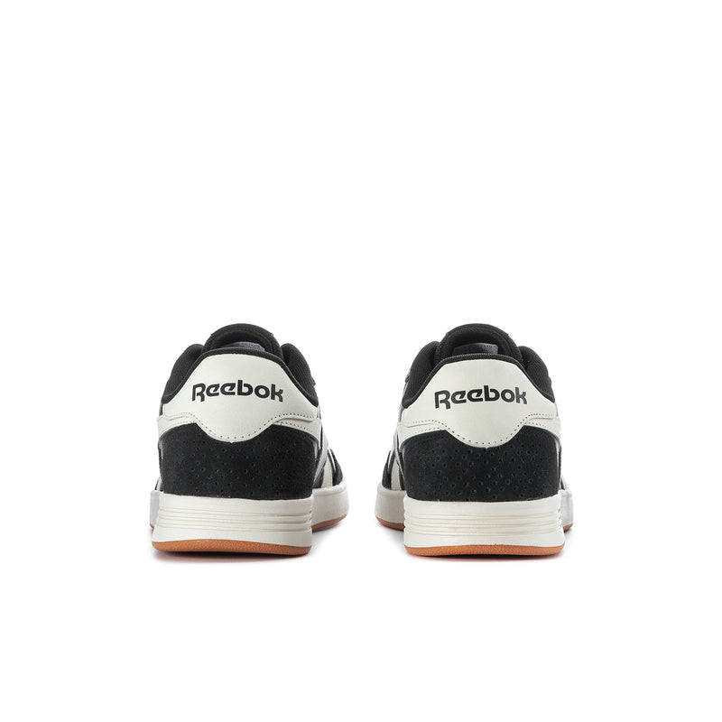 Men's Reebok Court Advance sneakers rear view, black with white heel panels and gum sole
