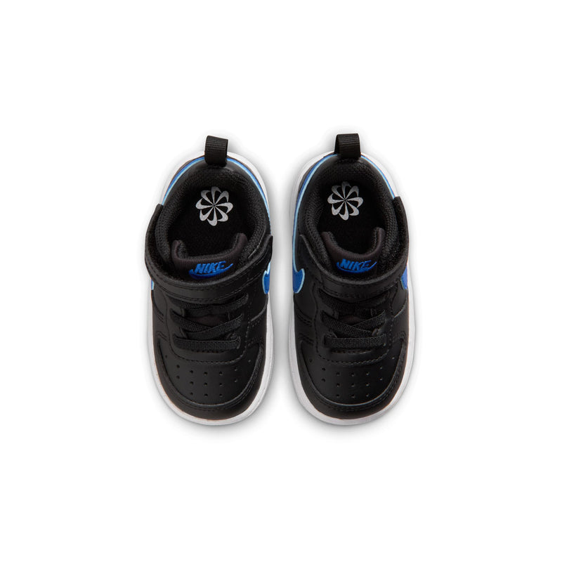 Kids' black low-top sneakers with blue swoosh and white accents, velcro strap