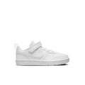 White kids low-top sneakers, side profile with hook-and-loop strap