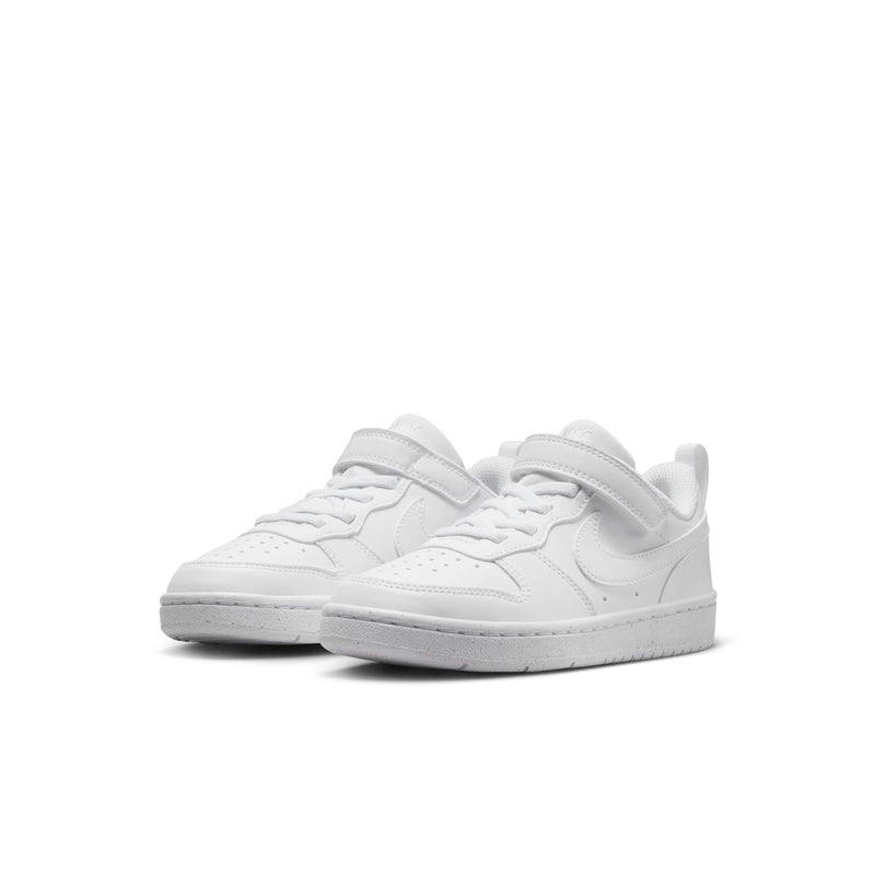 Pair of white kids low-top sneakers, front view with hook-and-loop strap