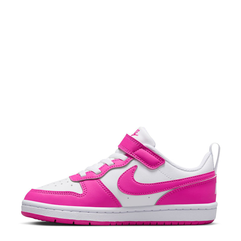Kids low-top sneakers side view: white leather with fuchsia swoosh and hook-and-loop strap.