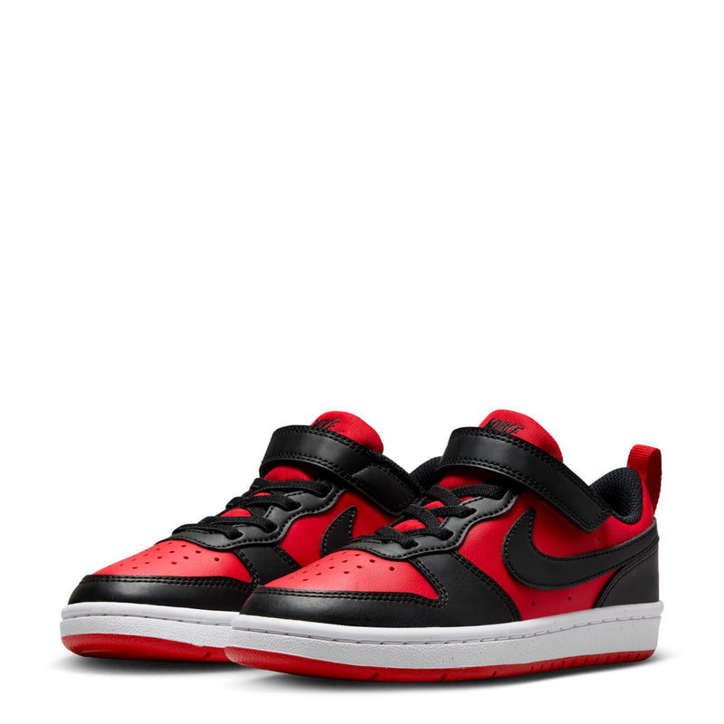 Kids low-top sneakers in red and black with white midsoles and Nike-style swooshes