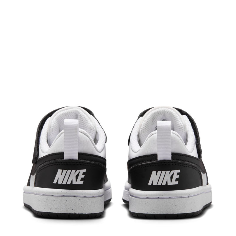 Back view of kids low-top sneakers, white uppers with black heel tab and Nike logo