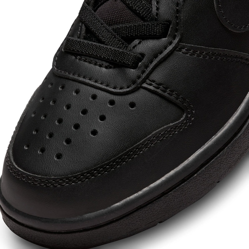 Kids black sneaker toe and midsole detail with perforations and stitched panels