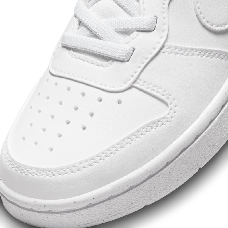 White kids low-top sneakers with perforated toe and hook-and-loop strap