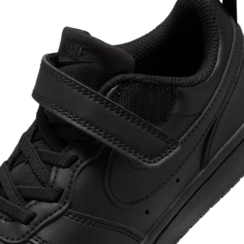 Kids black sneaker upper detail with swoosh, hook-and-loop strap, and padded tongue