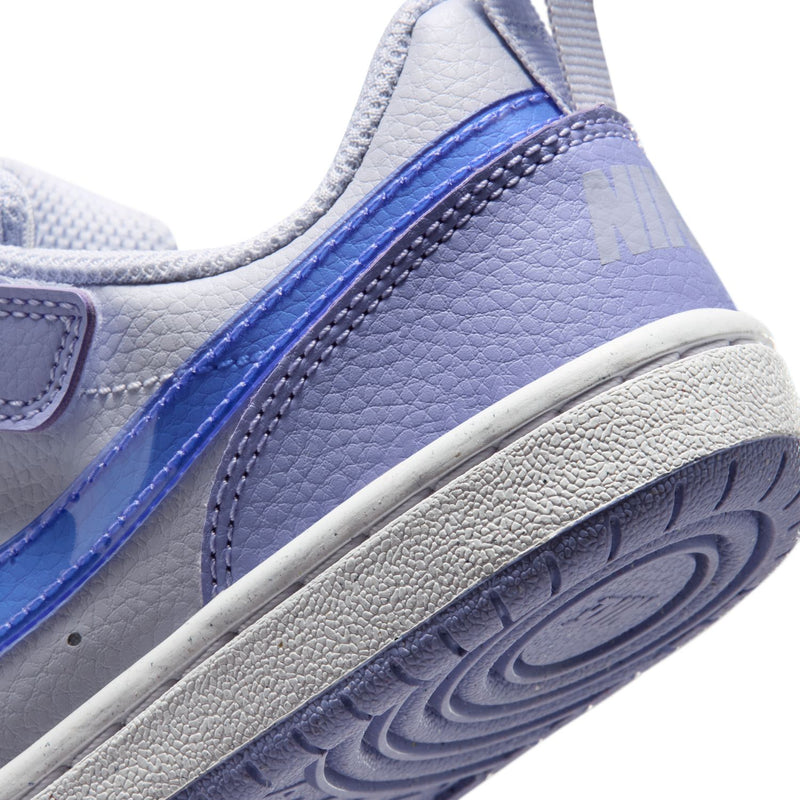 Kids sneaker side close-up showing textured outsole and light purple panels