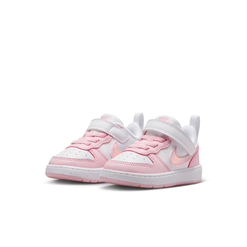 Toddler low-top sneakers in white and pink with double hook-and-loop closures.