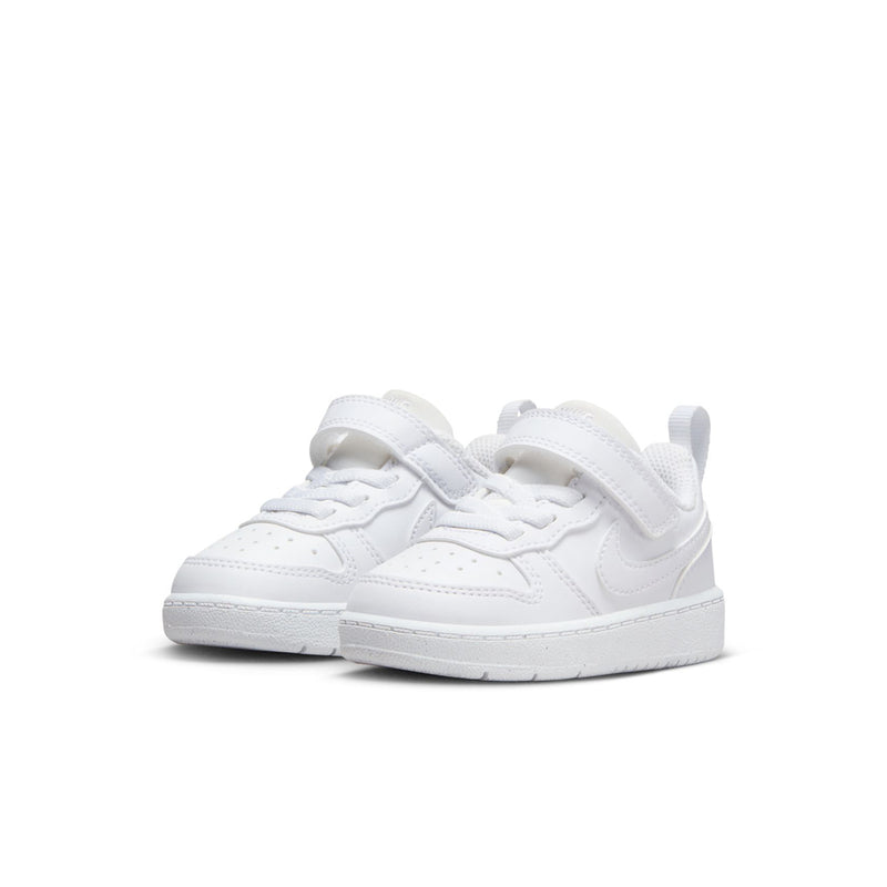 Toddler white low-top sneakers, side view with hook-and-loop strap closure