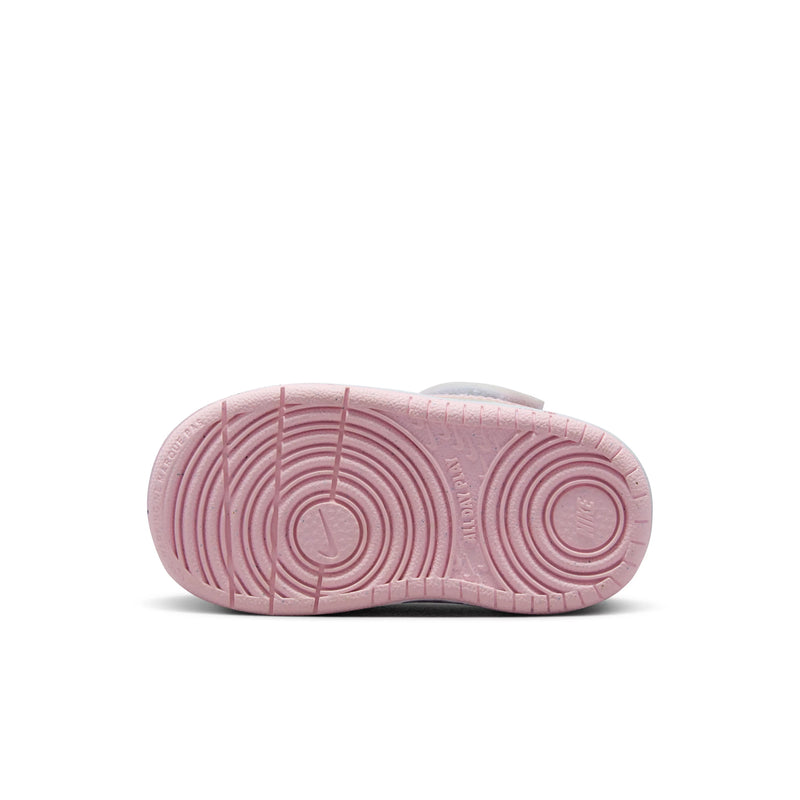 Toddler sneaker outsole in pink with textured tread for traction.