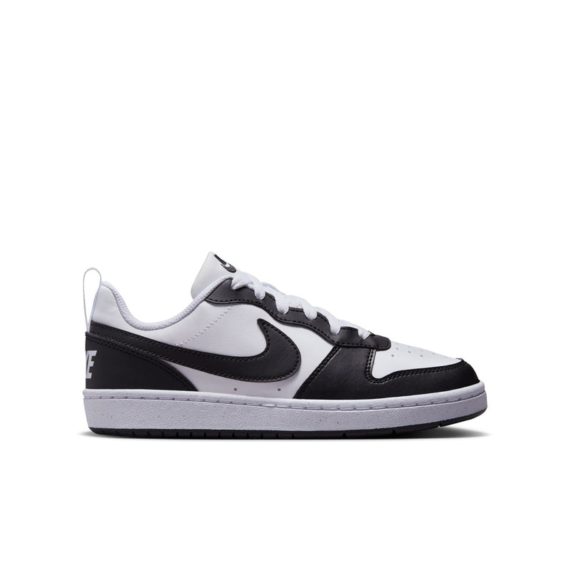 Youth low-top sneakers in white and black with swoosh logo and lace-up design