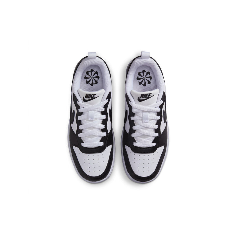 Pair of youth sneakers viewed from above, white uppers with black trim and swooshes