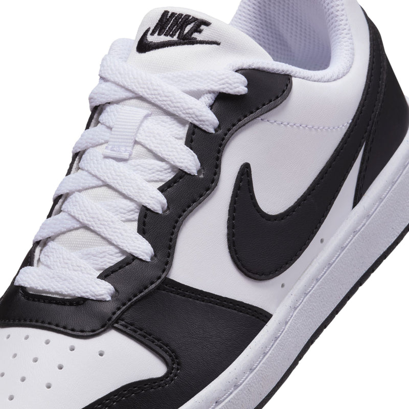 Close-up of youth sneaker upper: white laces, black swoosh, and padded collar