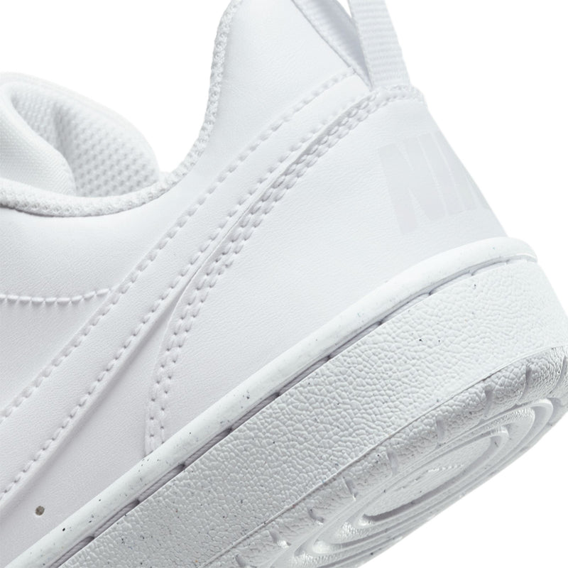 Youth white sneaker side detail with textured sole and stitched upper
