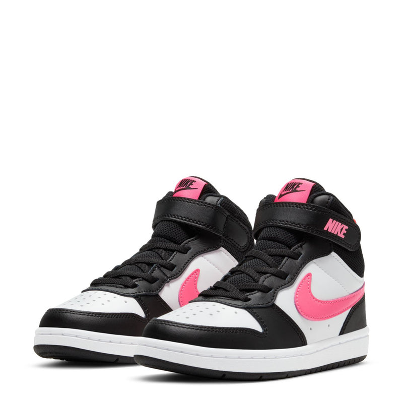 Pair of kids black and white mid-top sneakers with pink Nike swoosh and laces