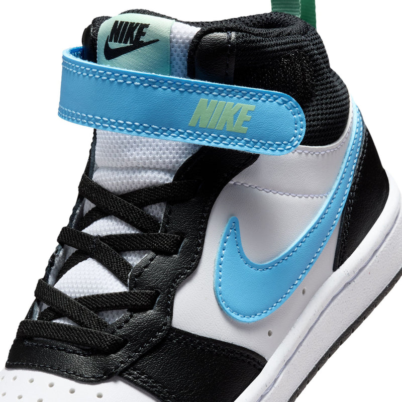 Close-up of kids sneaker upper with Nike tongue label and light blue strap