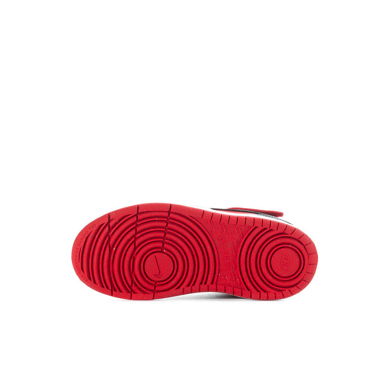 Toddler sneaker outsole in red with circular traction pattern