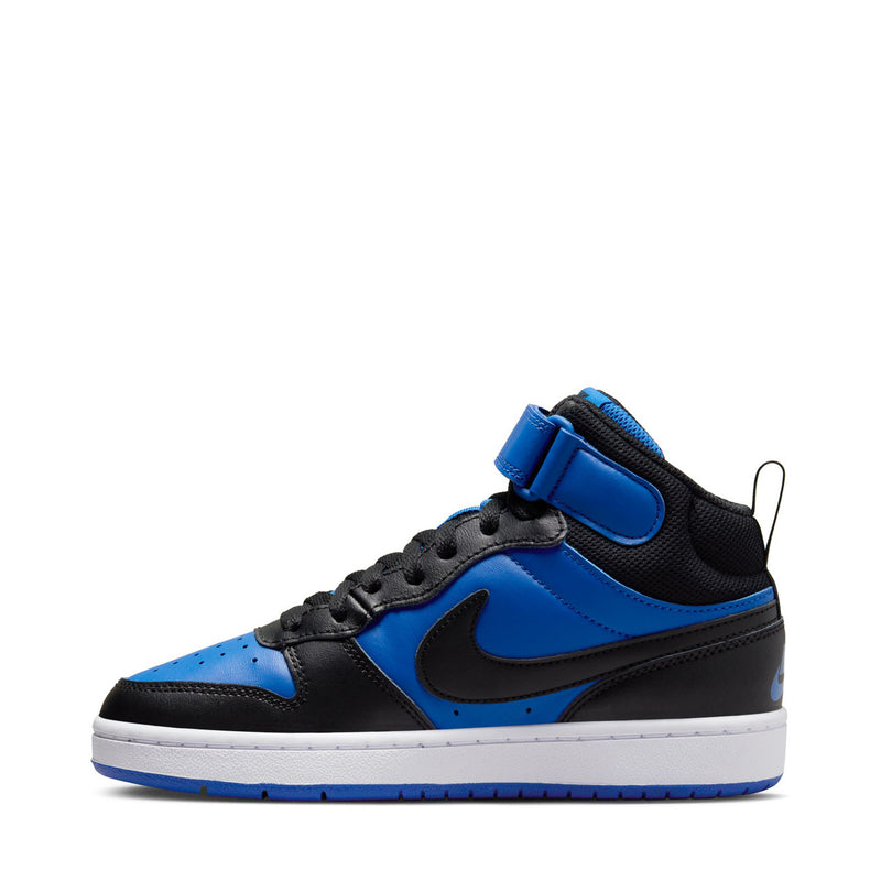 Mid-top youth sneakers side view in royal blue and black with white sole