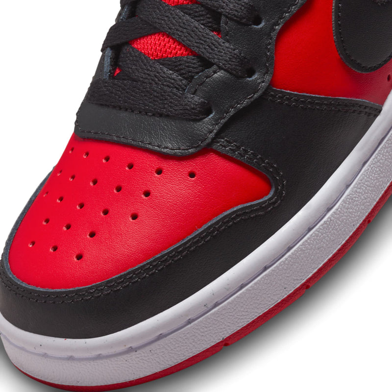 Close-up of youth Nike sneaker toe, red leather with black overlays and stitching