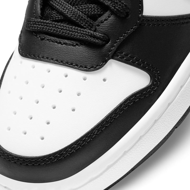 Youth sneaker toe and side panel close-up in black and white with stitched details