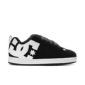 Black low-top sneakers with white star logo and DC-style side branding.
