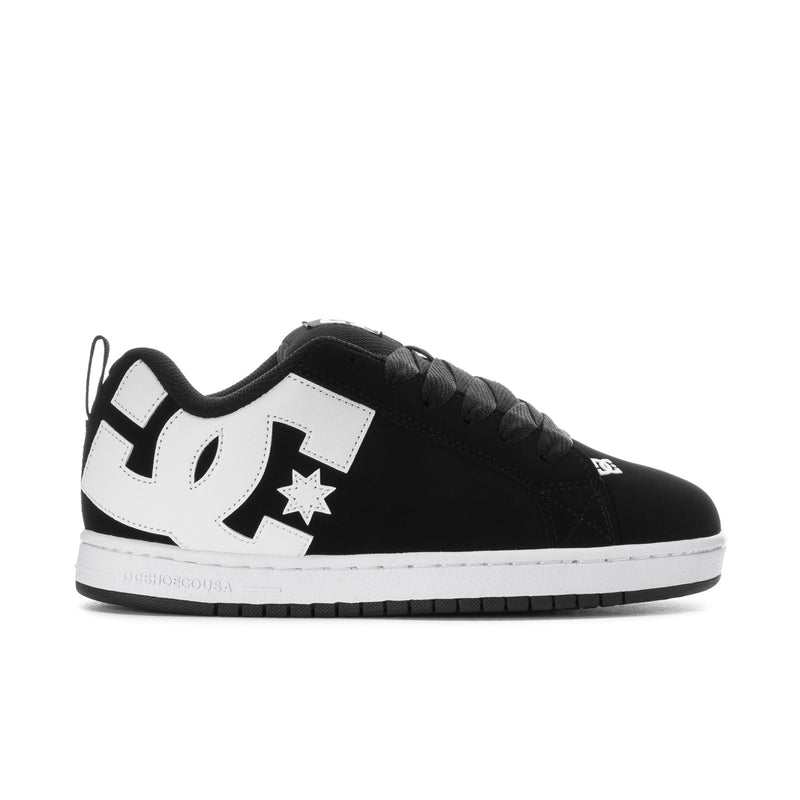Black low-top sneakers with white star logo and DC-style side branding.