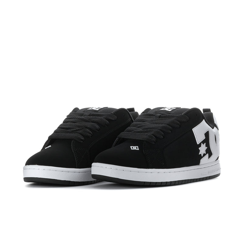 Black low-top sneakers with white star logo, showing the lace-up toe profile.