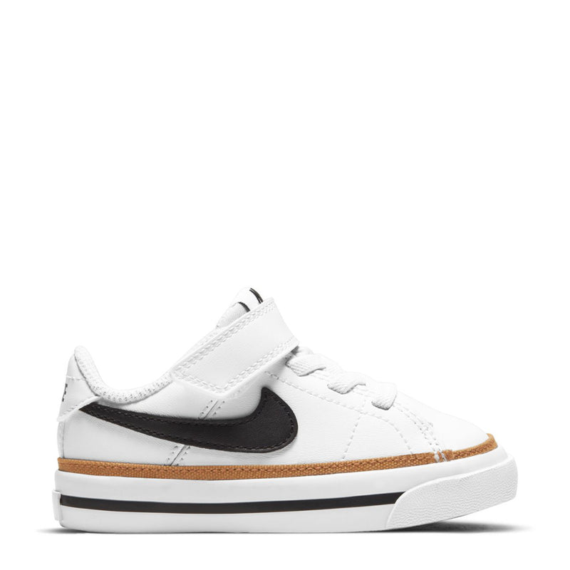 Toddler low-top sneakers in white with black swoosh and tan rubber sole