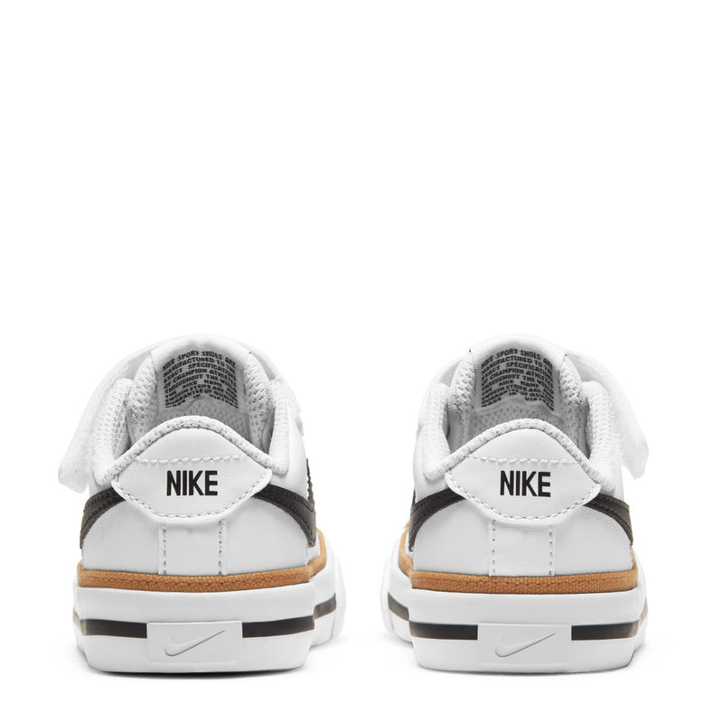 Toddler sneakers back view with NIKE heel logos, white uppers and tan outsole