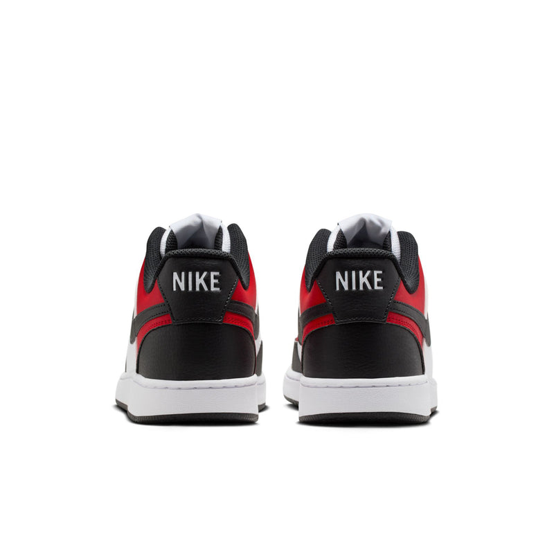 Back view of white, red, and black low-top sneakers with Nike logo on heel tabs.